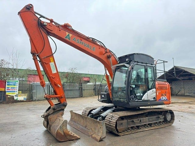Orange Ashvale excavator parked on construction site
