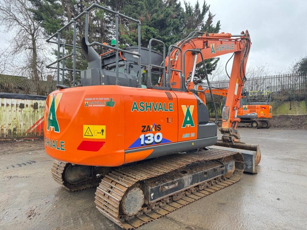 Orange Ashvale excavator parked on construction site