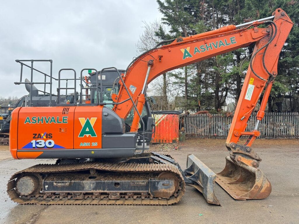 Orange Ashvale excavator parked on construction site