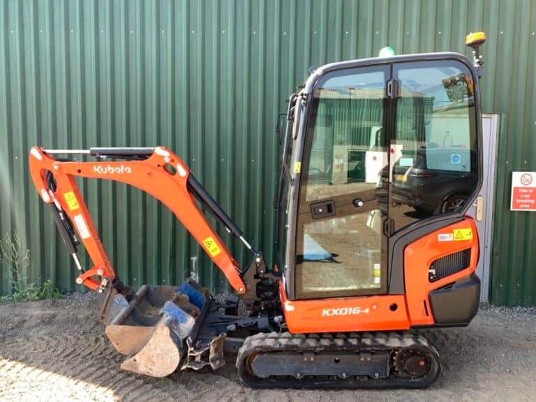 Orange Kubota mini excavator on construction site