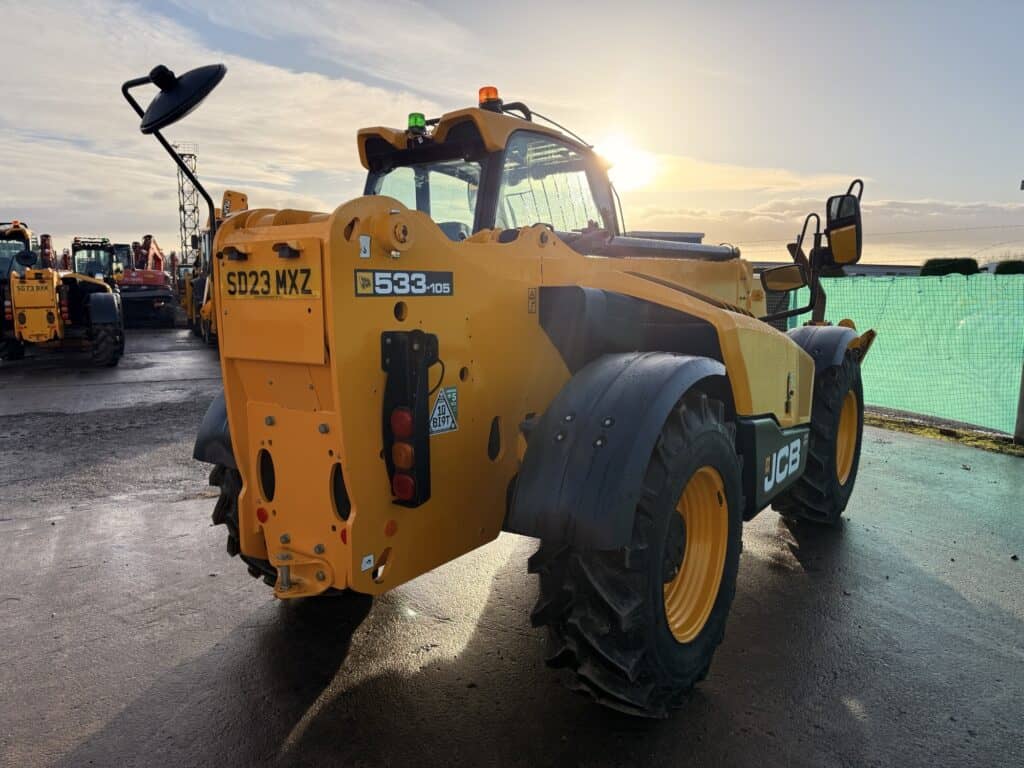 Yellow JCB telehandler parked in construction yard