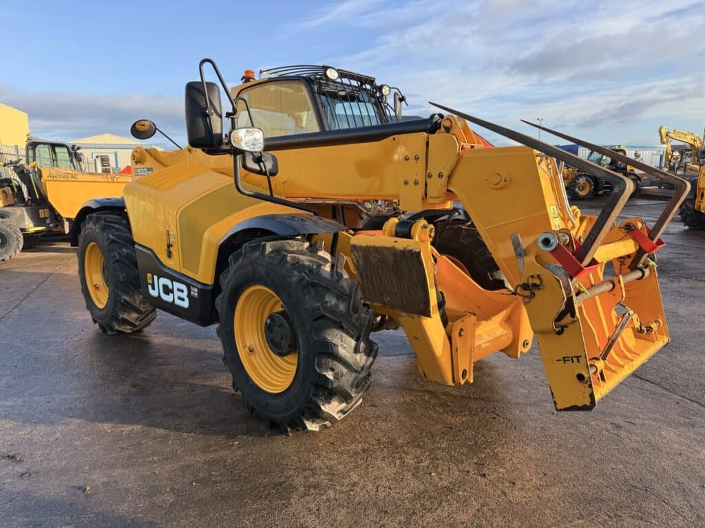 Yellow JCB telehandler on construction site