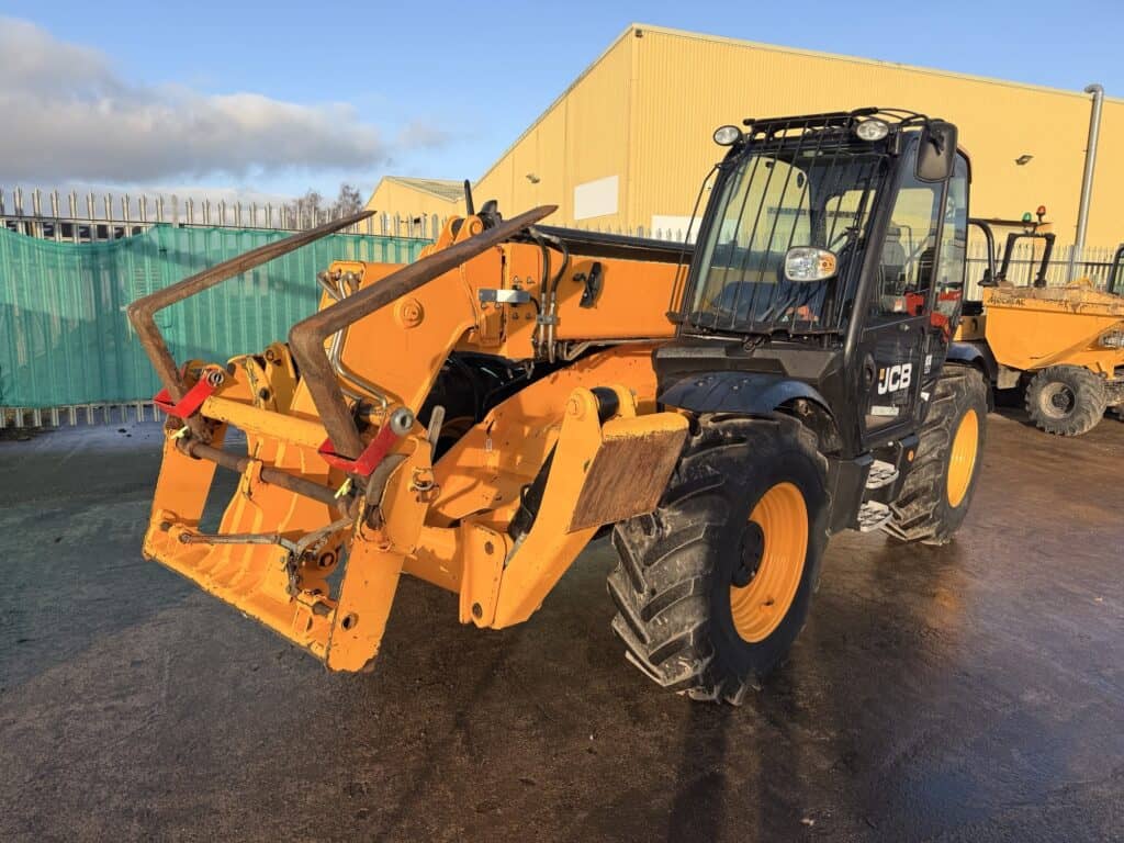 Yellow JCB telehandler parked on construction site